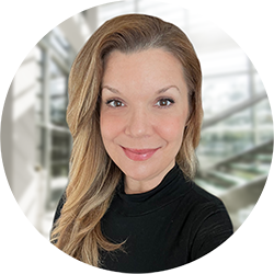 Barbara Costanzo with Blurry Office Foyer in the Background